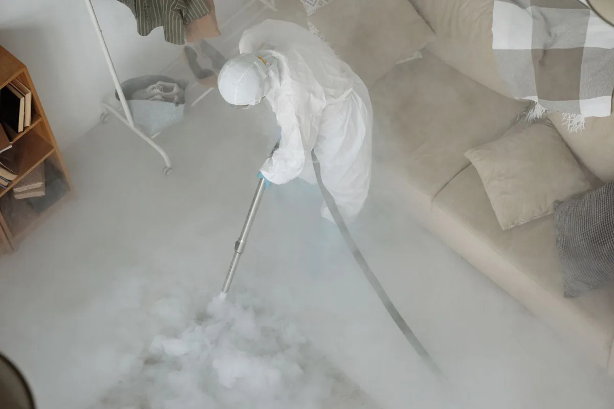 Biohazard cleanup technician in protective equipment, Carpendale, WV